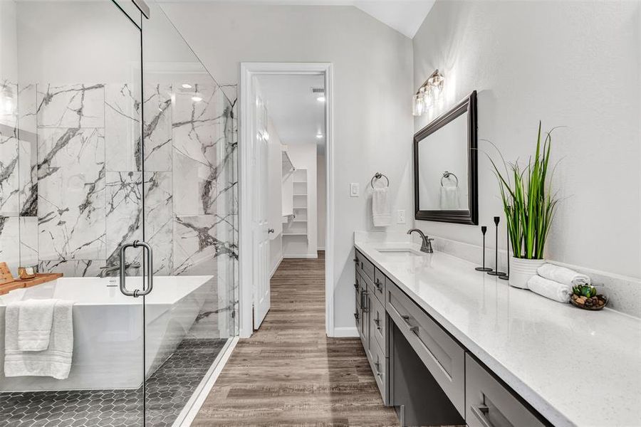 Primary Bathroom with separate wet room style shower and tub, wood-type flooring,   double vanity