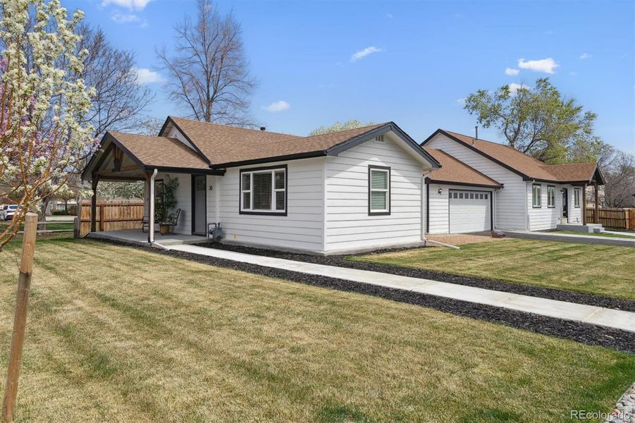 Front exterior of a new home in , Lakewood, CO, highlighting curb appeal (Image 19).