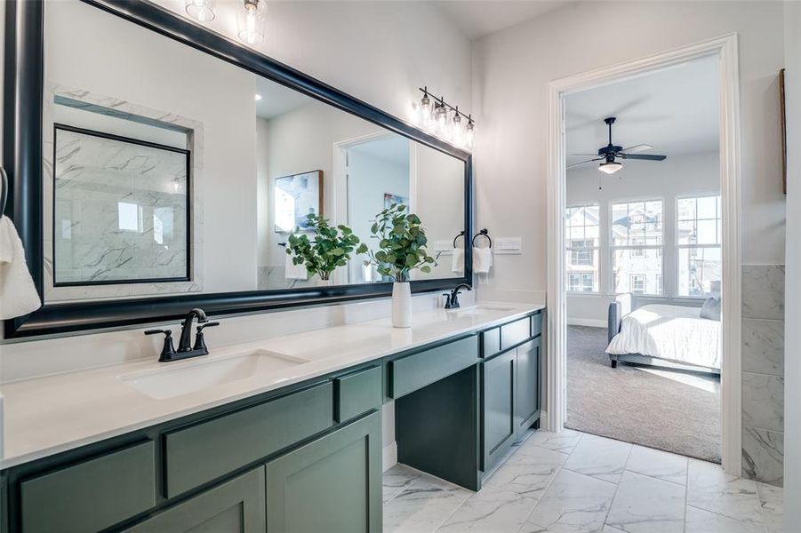 Bathroom with ceiling fan and vanity