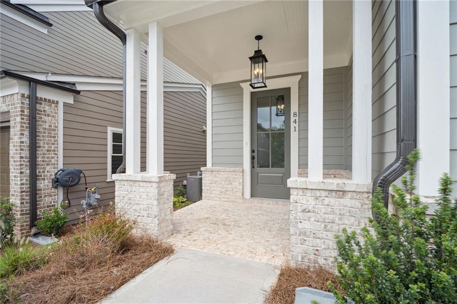 Exterior details and patio area of a home in Lakeside at River Green, Canton (Image 24).