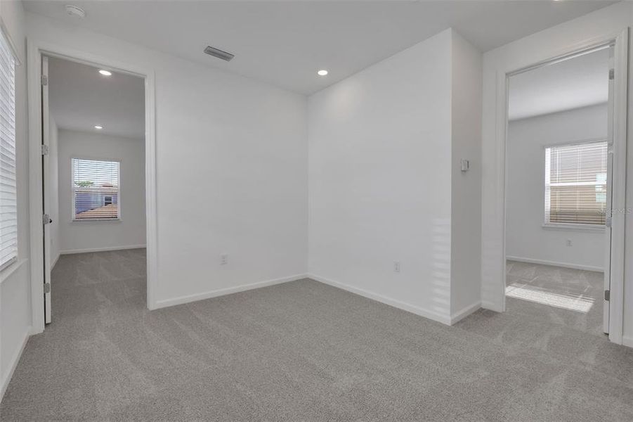 Spacious, unfurnished interior of a new home in Serenade at Ovation, Winter Garden (Image 24).