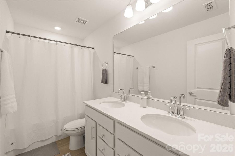 Second-floor full bath with dual sinks