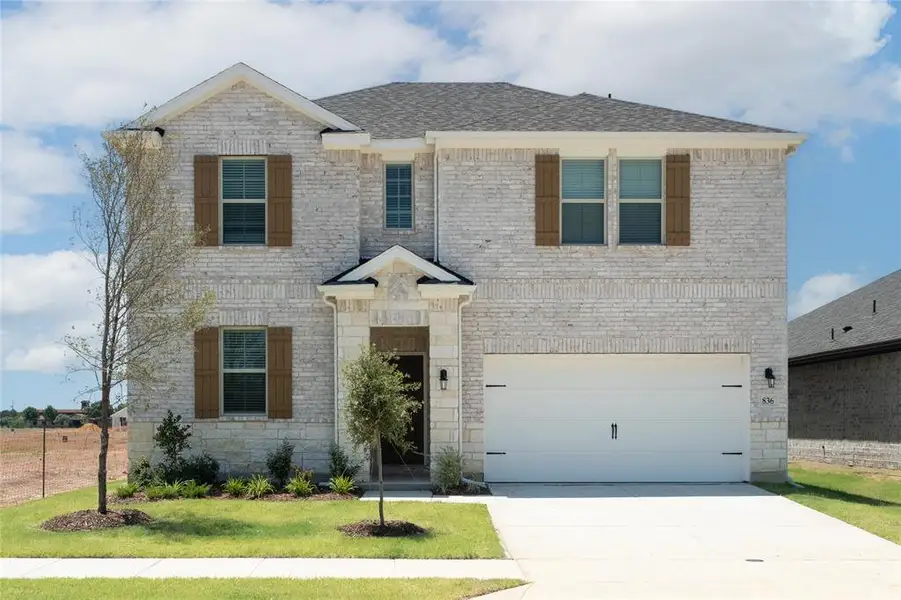 Front exterior of a new home in Lake Pointe: Lake Pointe at Paloma Creek, Little Elm, TX, highlighting curb appeal (Image 2).