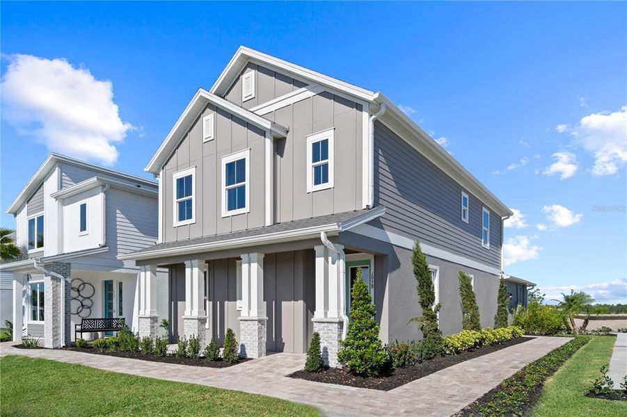 Front exterior of a new home in Trinity Place, St. Cloud, FL, highlighting curb appeal (Image 26).