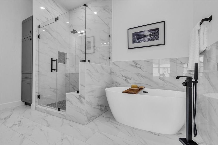 Indulge in ultimate relaxation with this luxurious freestanding tub, set in a stunning, modern bathroom oasis. Indulge in ultimate relaxation with this luxurious freestanding tub, set in a stunning, modern bathroom oasis.