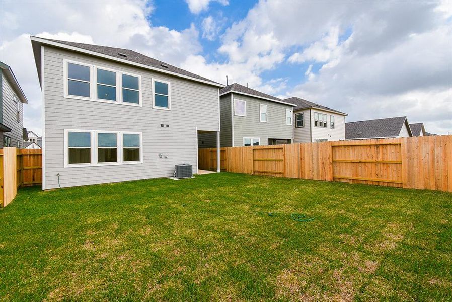 Imagine the possibilities in this expansive backyard, featuring a lush green lawn perfect for outdoor activities and relaxation. Imagine the possibilities in this expansive backyard, featuring a lush green lawn perfect for outdoor activities and relaxation.