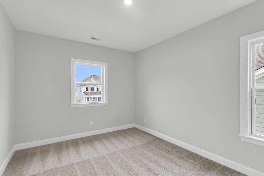 Spacious, unfurnished interior of a new home in Tidewater at Lakes of Cane Bay, Summerville (Image 33).