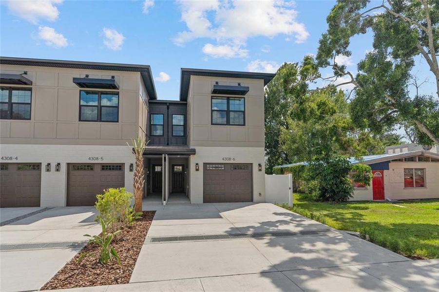 Front exterior of a new home in , Tampa, FL, highlighting curb appeal (Image 27).