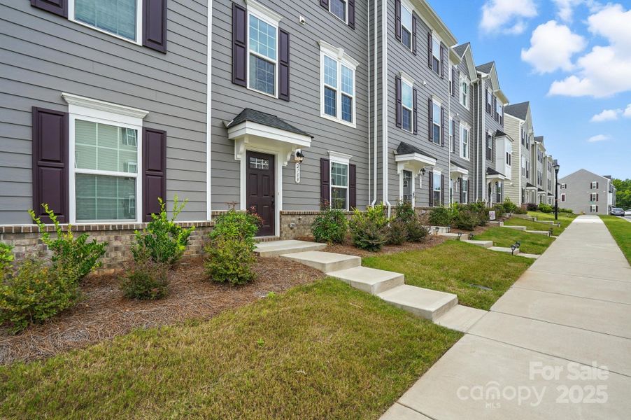 Front exterior of a new home in , Matthews, NC, highlighting curb appeal (Image 26).