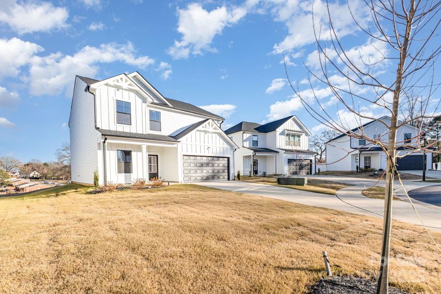 Front exterior of a new home in , Mooresville, NC, highlighting curb appeal (Image 17).