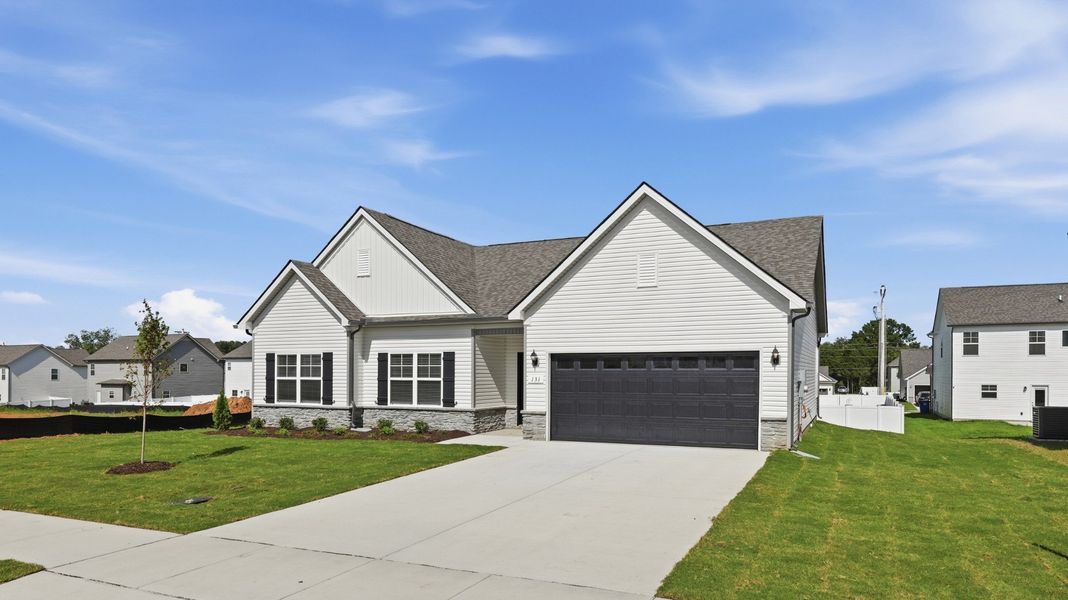 Front exterior of a new home in Wheatfield, Shelbyville, TN, highlighting curb appeal (Image 19).
