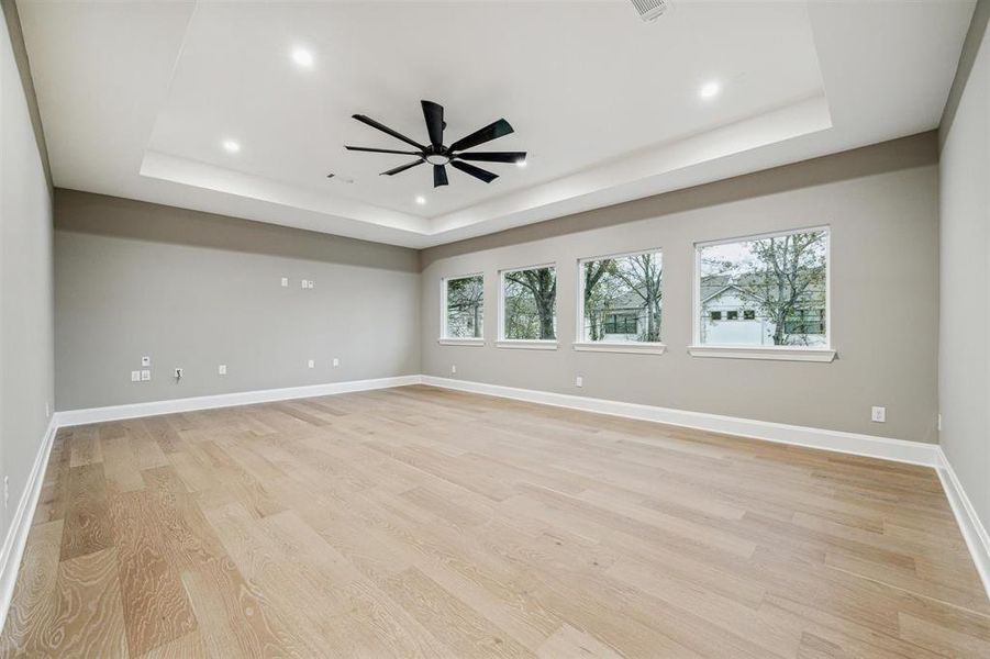 Massive game room with large picture windows looking out to the trees