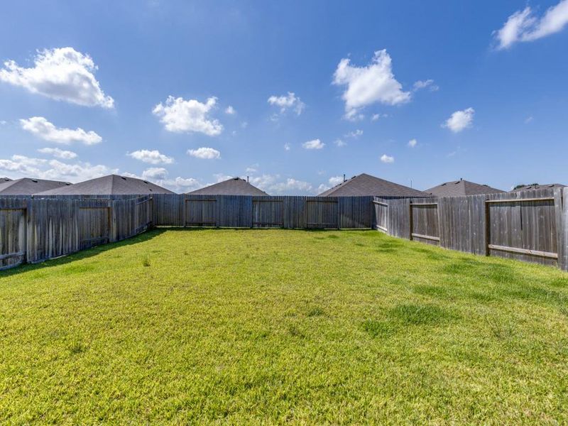 Exterior details and patio area of a home in Grand Pines, Magnolia (Image 22).