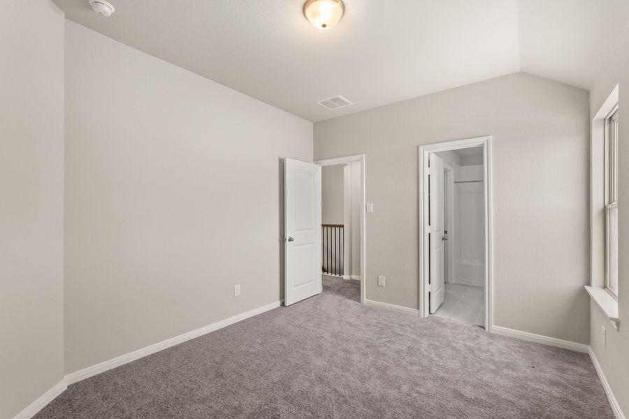 An additional view of the third bedroom with private bath and walk in closet.