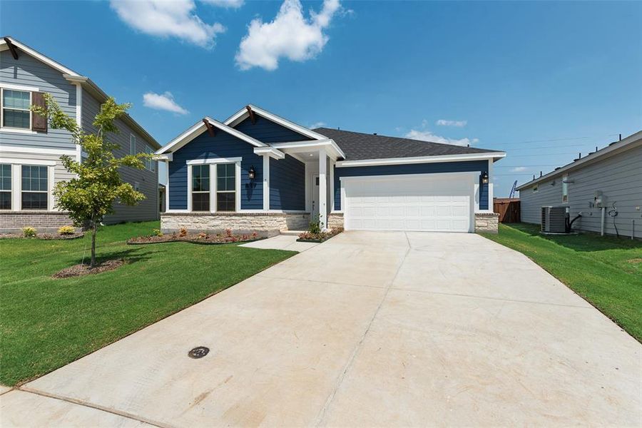 Front exterior of a new home in Creekside of Crowley, Crowley, TX, highlighting curb appeal (Image 18). Front exterior of a new home in Creekside of Crowley, Crowley, TX, highlighting curb appeal (Image 18).