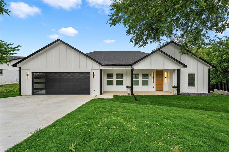 Front exterior of a new home in , Woodway, TX, highlighting curb appeal (Image 24).