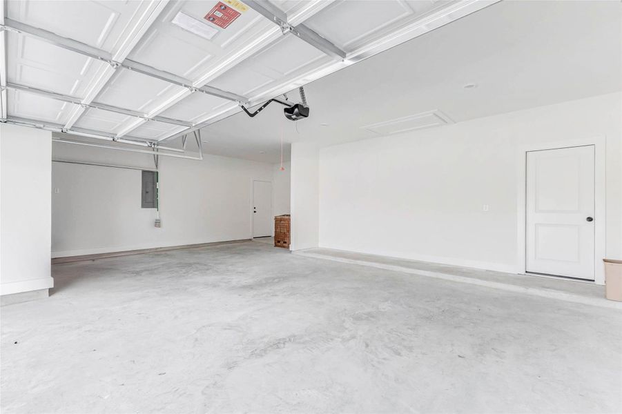 Great builder design that has an exterior door to the side yard. There's even a concrete pad right outside that door. Engineered attic storage with generous walking and head space — ideal for seasonal storage or projects.