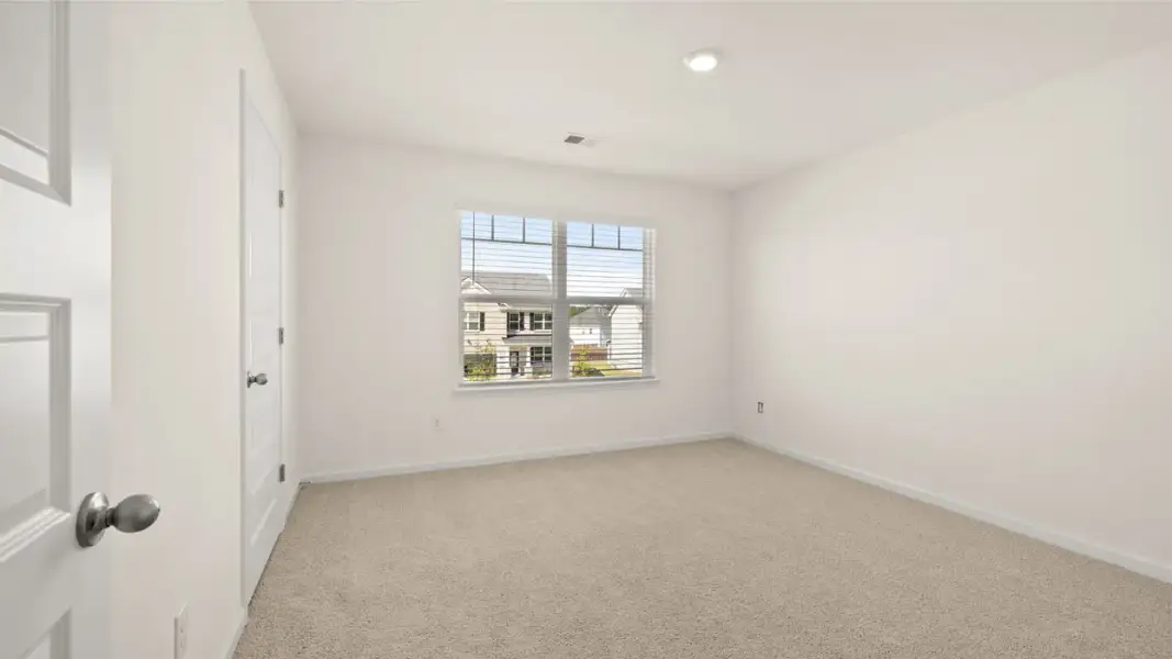 Spacious, unfurnished interior of a new home in The Highlands at Cedar Hill Landing, Navassa (Image 23).