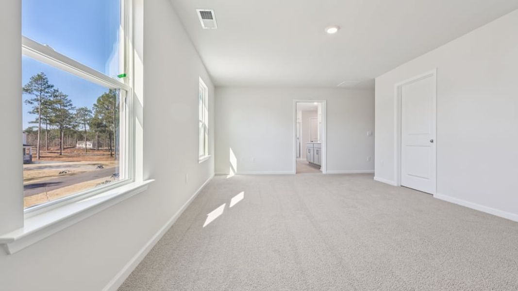 Spacious, unfurnished interior of a new home in Gretchen Pines, West End (Image 15).