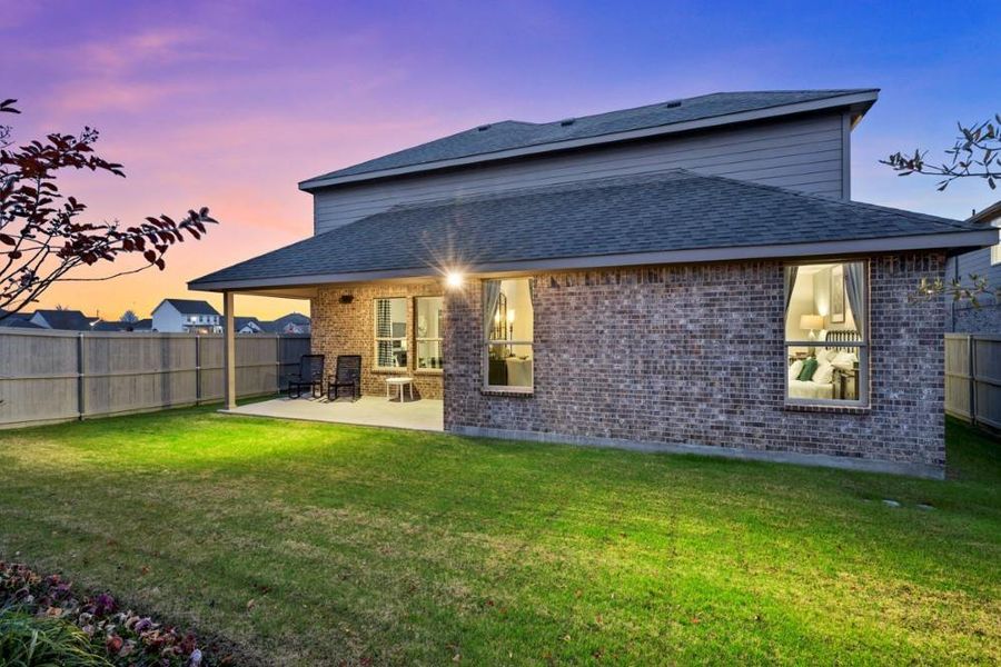 Exterior details and patio area of a home in Pecan Square, Northlake (Image 3).