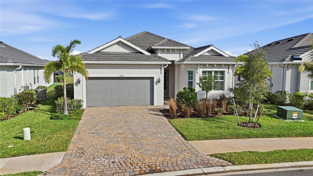 Front exterior of a new home in , Punta Gorda, FL, highlighting curb appeal (Image 1).