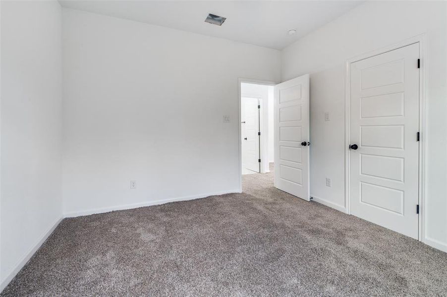 Unfurnished bedroom featuring carpet flooring