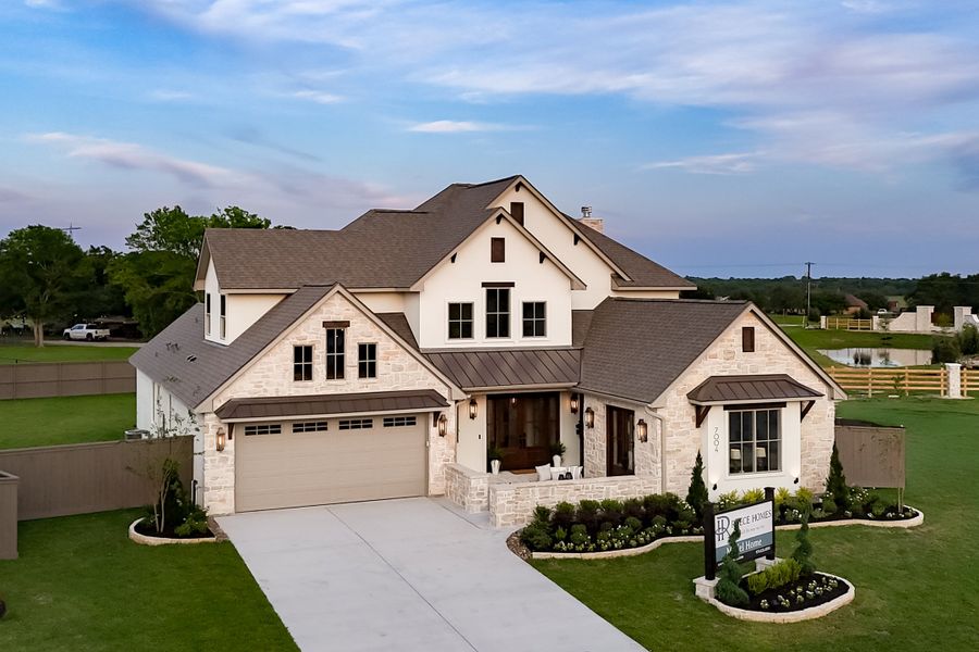 Front exterior of a new home in Stella Ranch, Bryan, TX, highlighting curb appeal (Image 25).