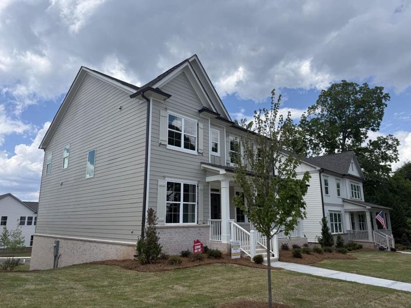 Front exterior of a new home in Hemingway, Flowery Branch, GA, highlighting curb appeal (Image 24).