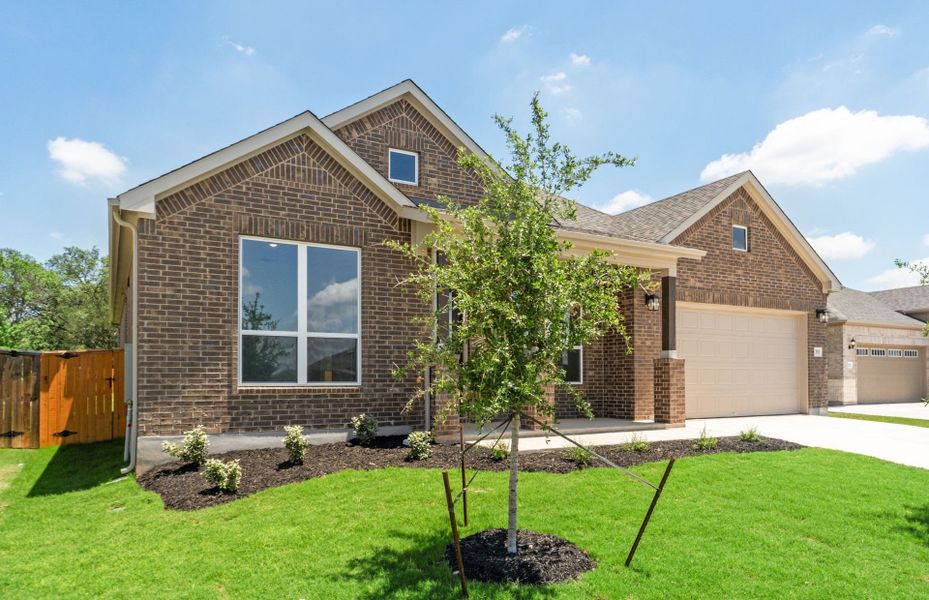 Front exterior of a new home in 6 Creeks, Kyle, TX, highlighting curb appeal (Image 21).