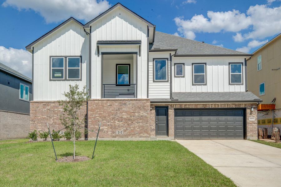 Front exterior of a new home in Townsen Landing, Humble, TX, highlighting curb appeal (Image 1).