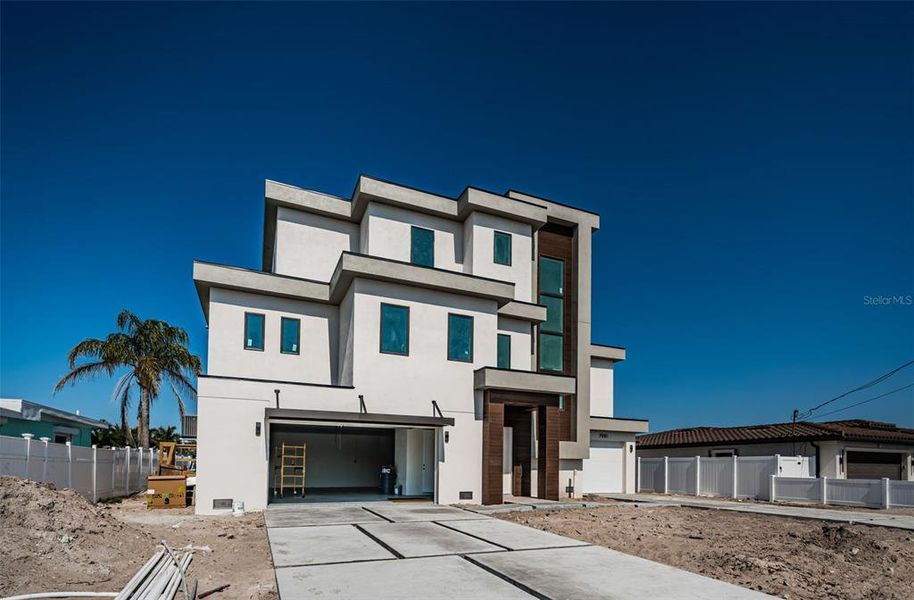 Front exterior of a new home in , St. Petersburg, FL, highlighting curb appeal (Image 1). Front exterior of a new home in , St. Petersburg, FL, highlighting curb appeal (Image 1).