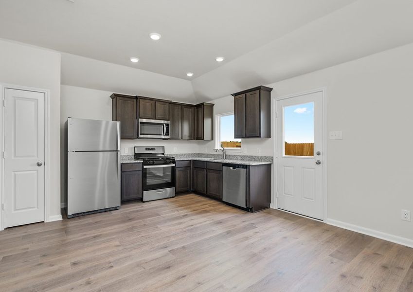 The kitchen has a pantry to store food and other kitchen essentials.