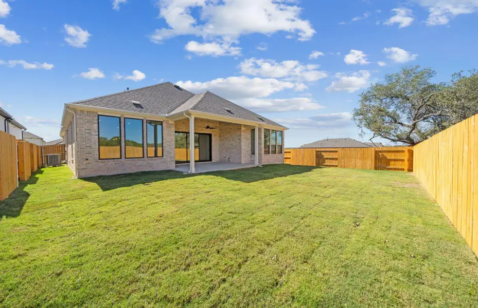 Exterior details and patio area of a home in 6 Creeks, Kyle (Image 2).