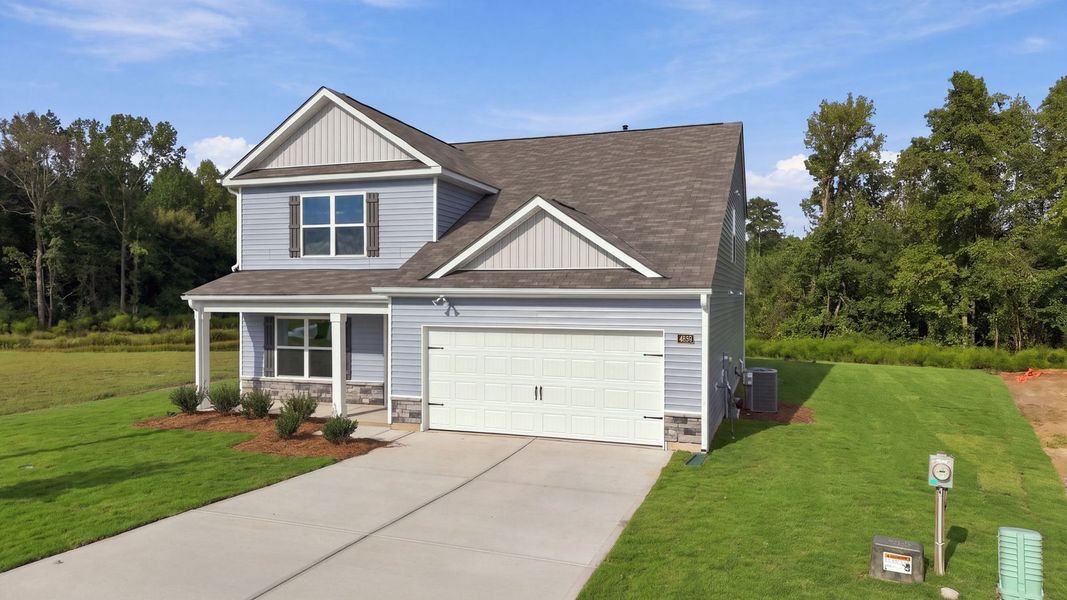 Front exterior of a new home in Bynum Farms, Farmville, NC, highlighting curb appeal (Image 14).