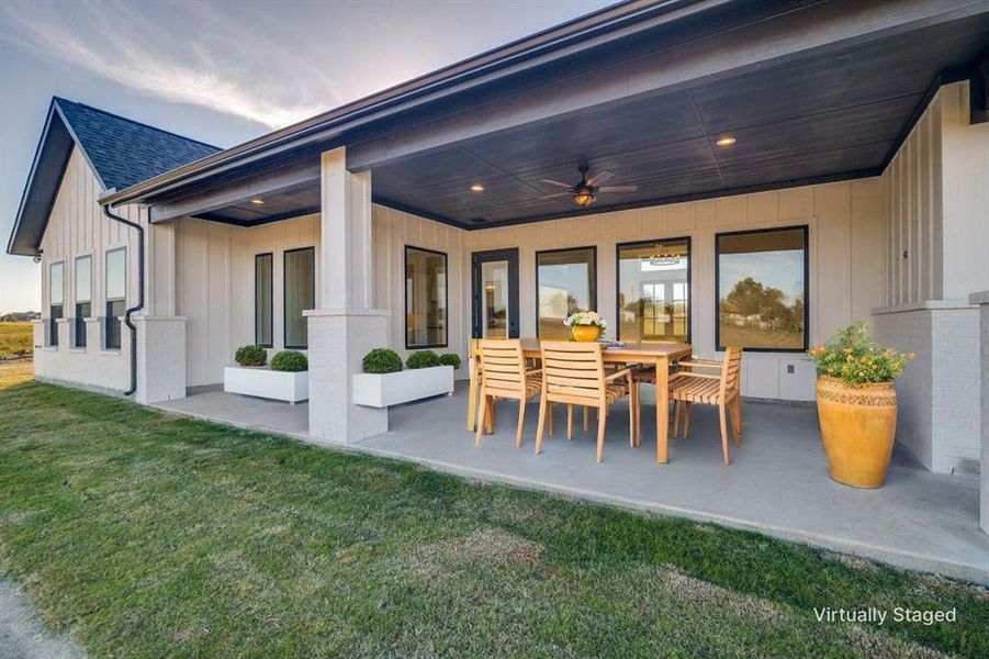 View of patio / terrace featuring a ceiling fan and outdoor dining space