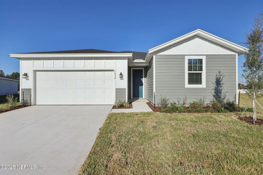Front exterior of a new home in Cypress Meadows - Signature Series, Jacksonville, FL, highlighting curb appeal (Image 1).