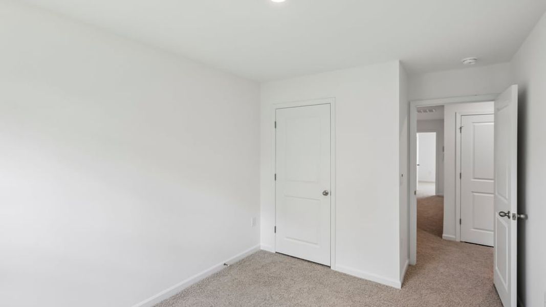 Spacious, unfurnished interior of a new home in The Townes at Belle Grove, Wendell (Image 14).