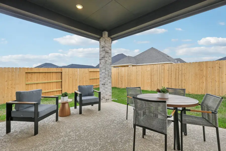Exterior details and patio area of a home in Sunterra, Katy (Image 3).
