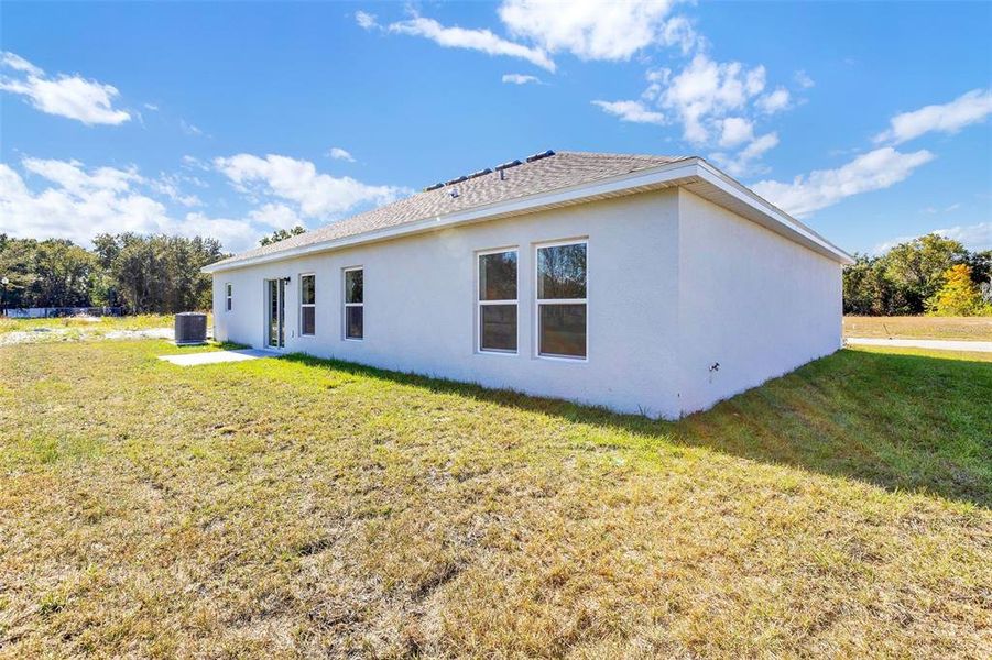 Exterior details and patio area of a home in Grand Oaks, Avon Park (Image 10).