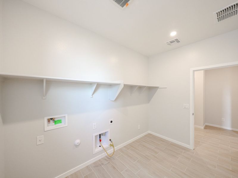 A room with a white wall and a white door.