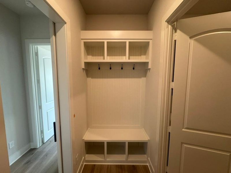 Built-in hall tree with beadboard backing, integrated bench seating, and upper cubby storage Built-in hall tree with beadboard backing, integrated bench seating, and upper cubby storage