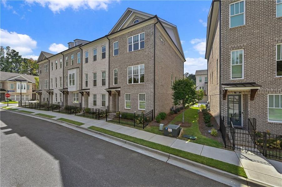 Front exterior of a new home in , Johns Creek, GA, highlighting curb appeal (Image 21).