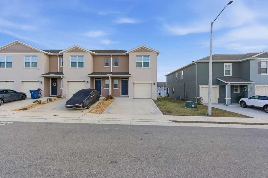 Front exterior of a new home in Brentwood, Davenport, FL, highlighting curb appeal (Image 23).