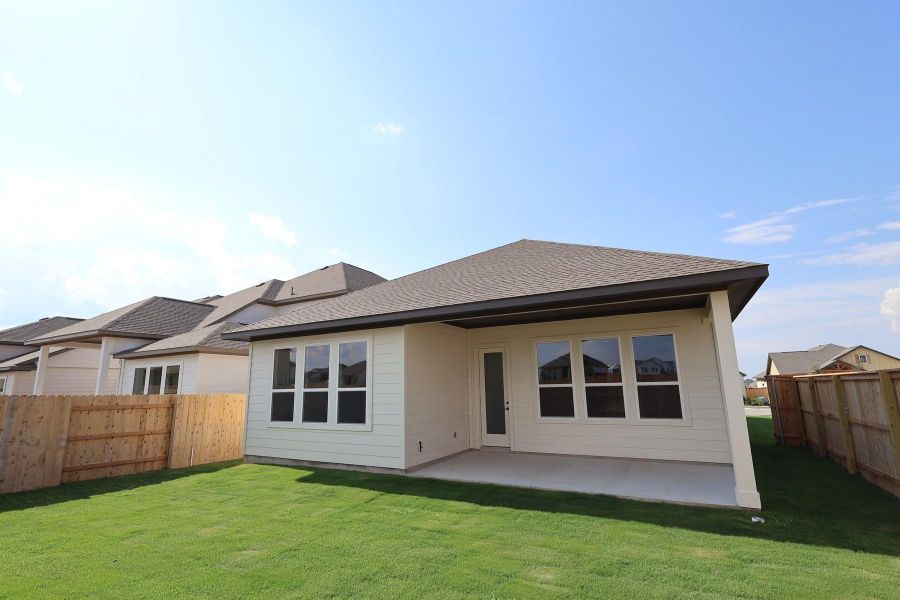 Front exterior of a new home in Arbor Collection At Park Central, Georgetown, TX, highlighting curb appeal (Image 2). Front exterior of a new home in Arbor Collection At Park Central, Georgetown, TX, highlighting curb appeal (Image 2).