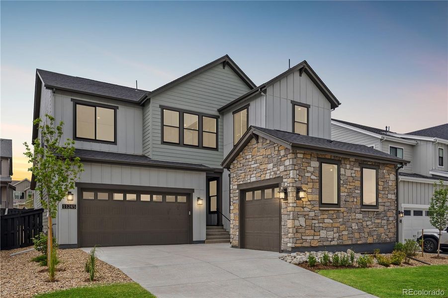 Front exterior of a new home in Stargaze at Solstice, Littleton, CO, highlighting curb appeal (Image 1).