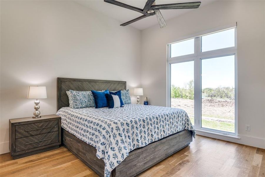 Bedroom featuring light wood-type flooring and ceiling fan