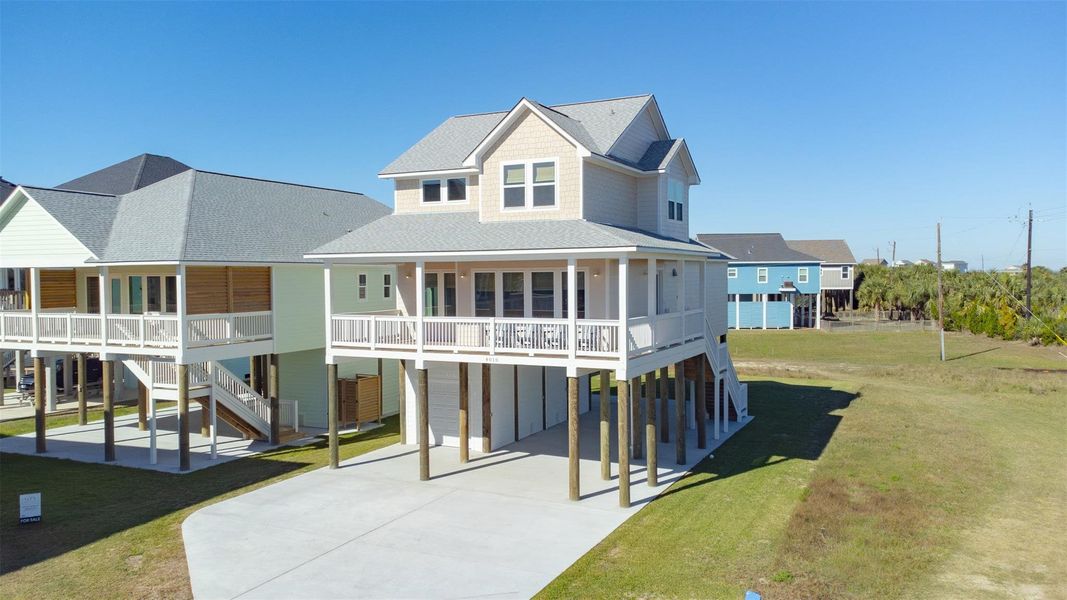 Front exterior of a new home in , Galveston, TX, highlighting curb appeal (Image 22).