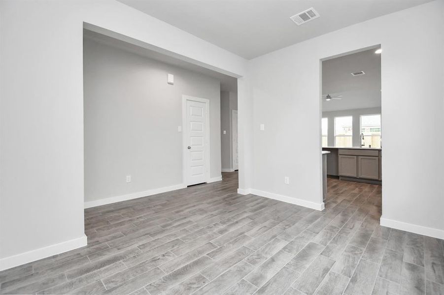 Another view of the dining room. Sample photo of completed home with same plan. Actual colors and selections may vary.