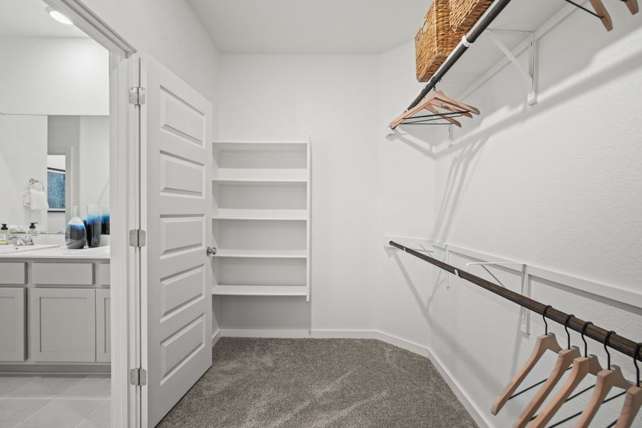Primary Closet in the Oak home plan by Trophy Signature Homes – REPRESENTATIVE PHOTO