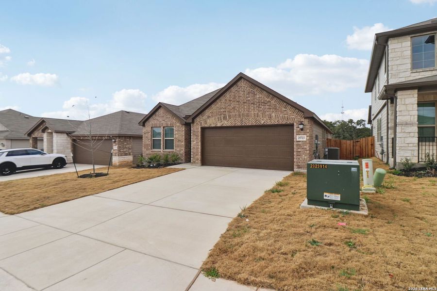 Front exterior of a new home in Scenic Crest - Premier Series, Boerne, TX, highlighting curb appeal (Image 25).